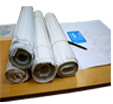 desk with rolled up documents